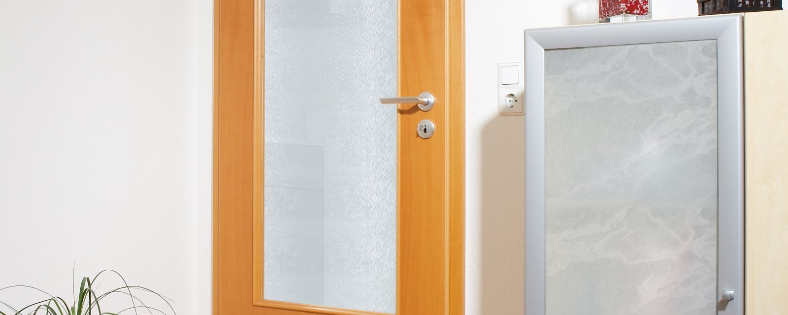 Cabinet door and door cut-out with polystyrene glass